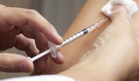 doctor-inserting-syringe-into-skin
